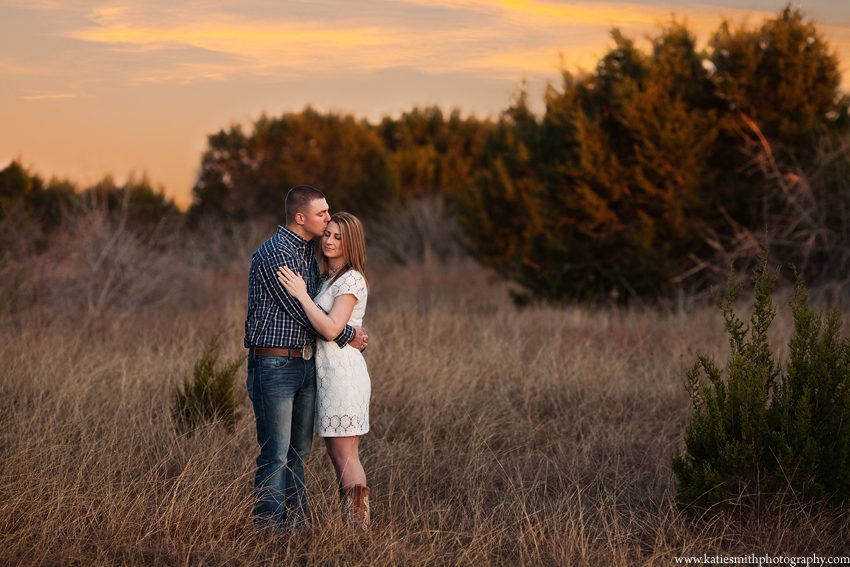 Couple in field at Sunset