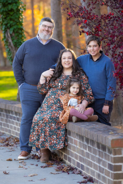 A family portrait taken during the fall that showcases what to wear to feel like real life outfits.